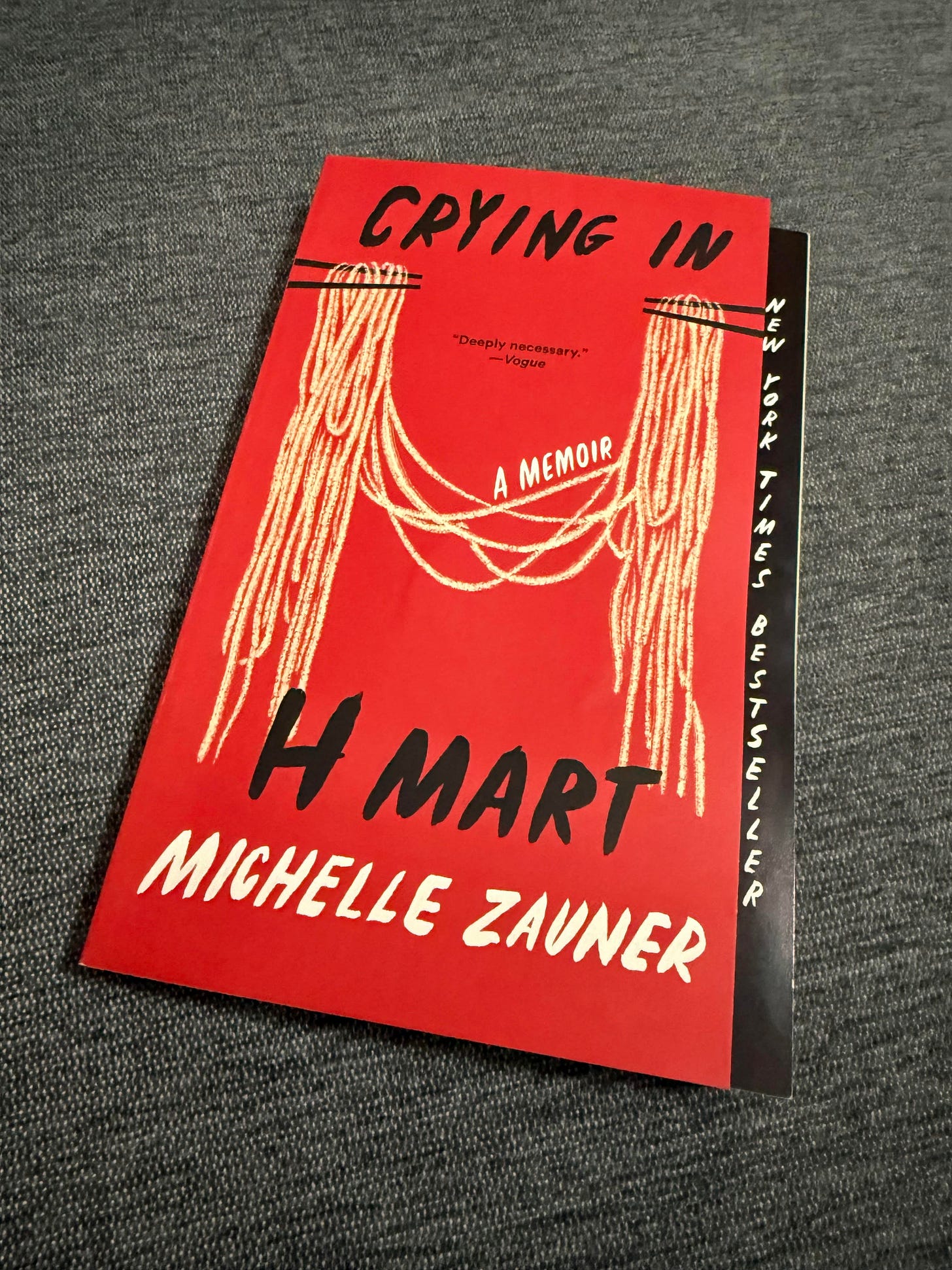 Paperback book on gray cloth. 