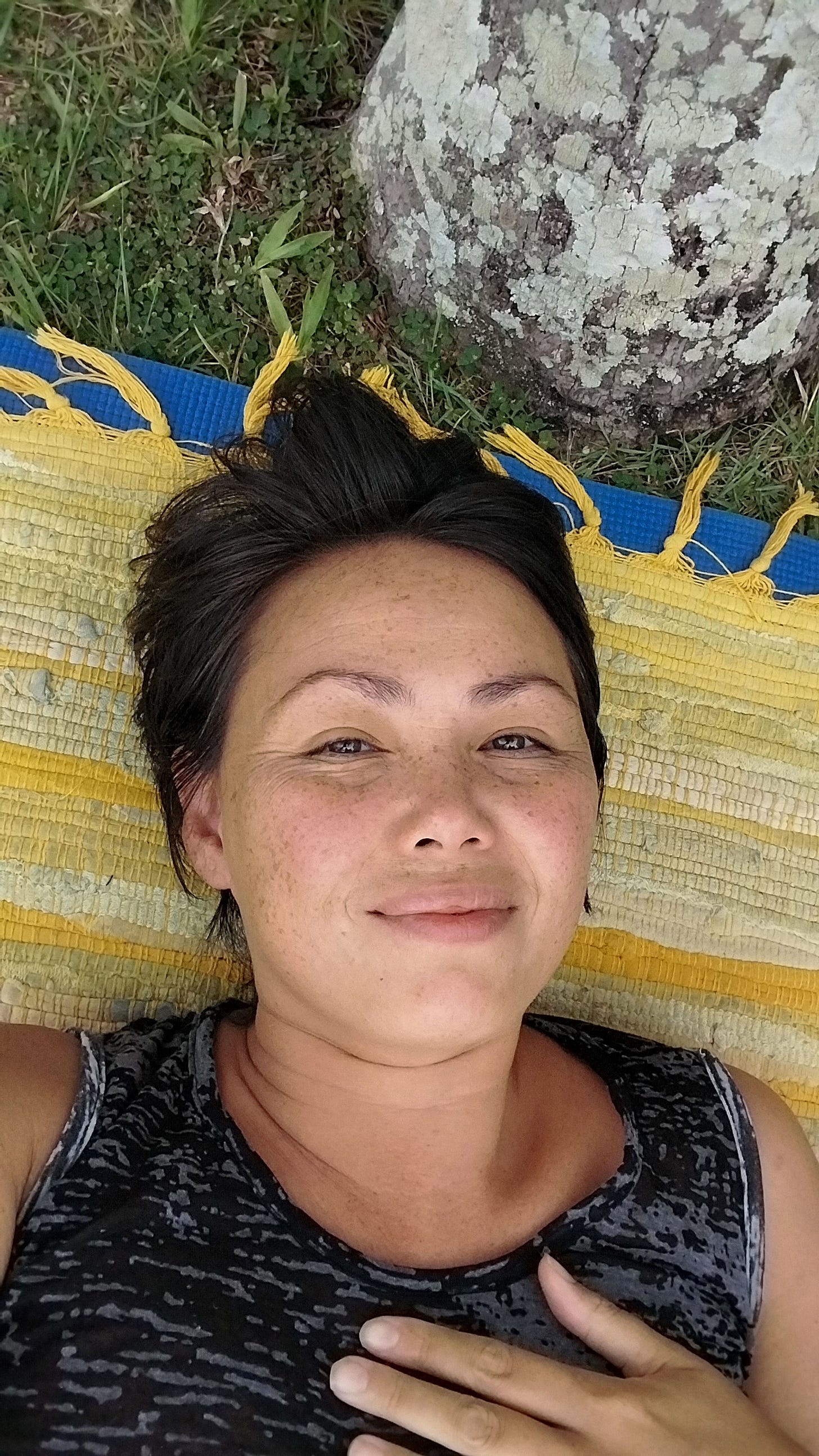 Fiona lying on a rug under a tree Fiona lying on a rug under a tree