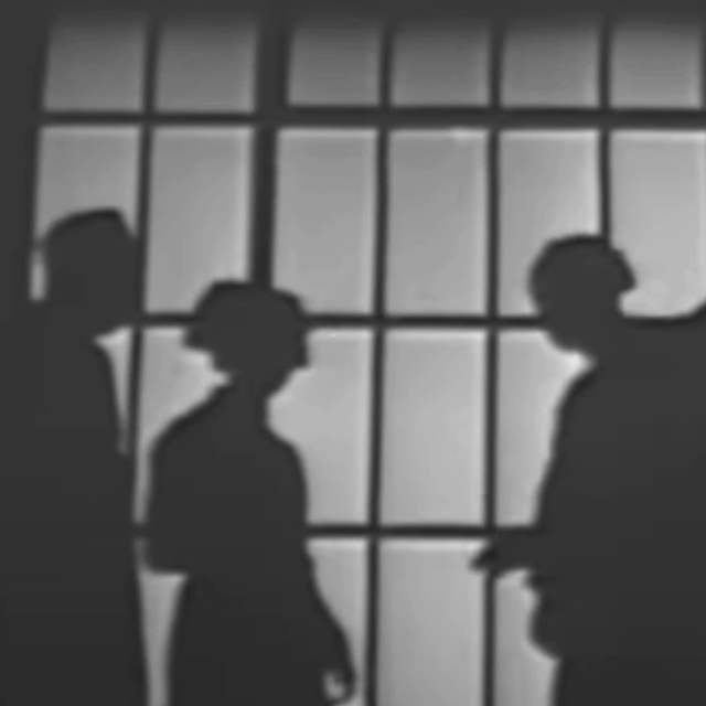 Medics move in silhouette behind a window - animated gif