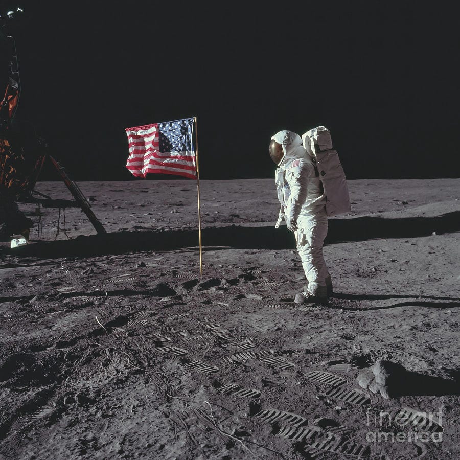 US flag on the moon Photograph by Courtesy of NASA