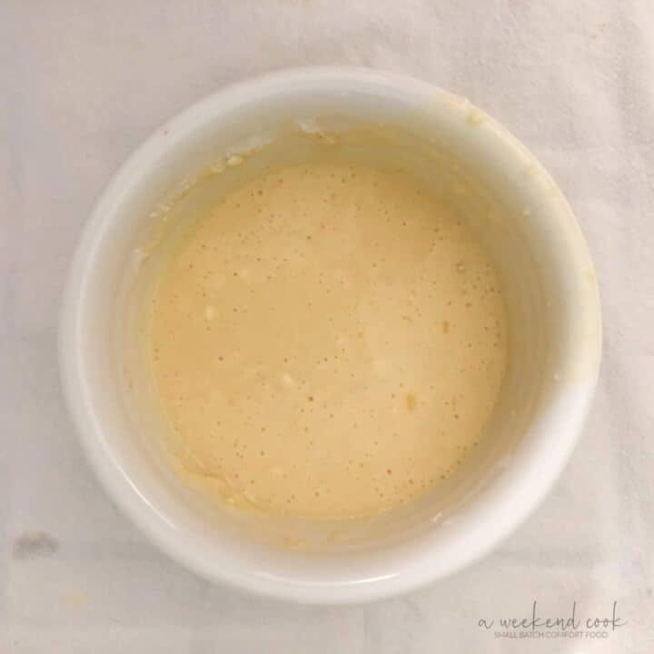 Pancake batter in white farmhouse bowl.