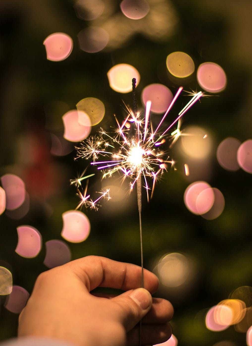 The One Thing: broken photography of a person holding a sparkler
