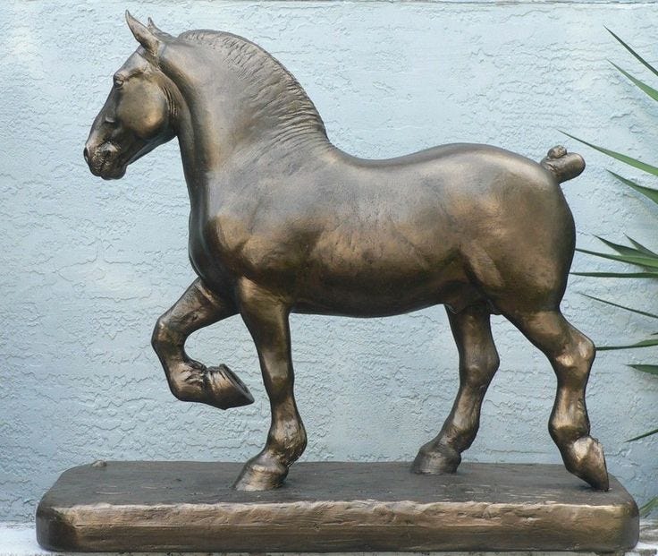 This may contain: a bronze statue of a horse on a base This may contain: a bronze statue of a horse on a base