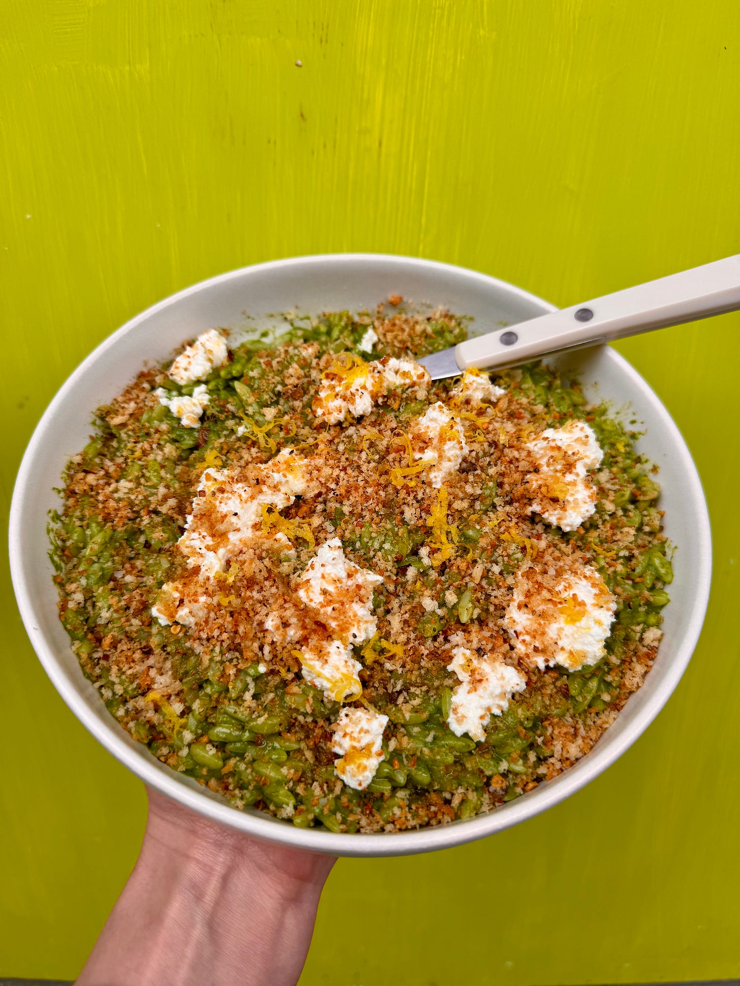 Orzo in arugula sauce topped with ricotta and umami breadcrumbs Orzo in arugula sauce topped with ricotta and umami breadcrumbs