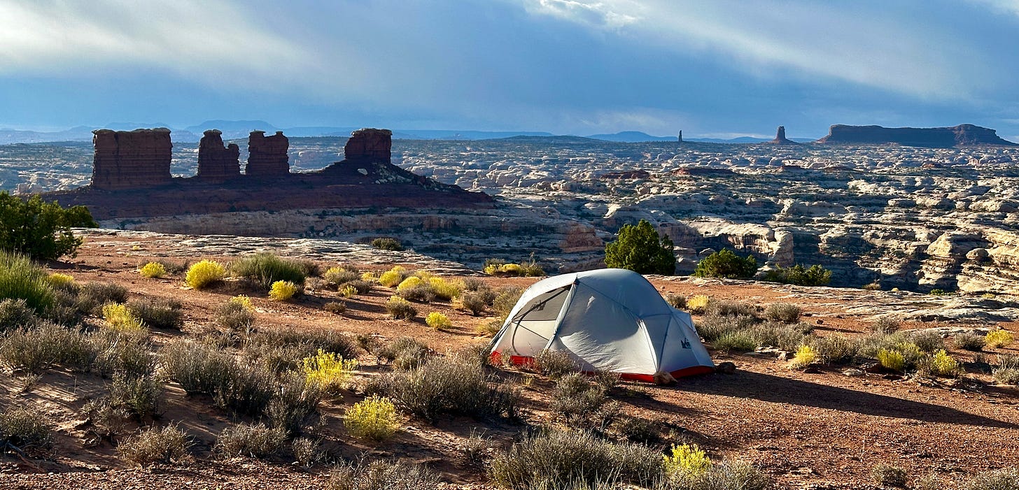 A tent in the desert

Description automatically generated