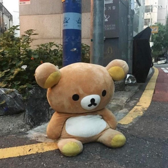 Sad bear on the sidewalks of Japan
