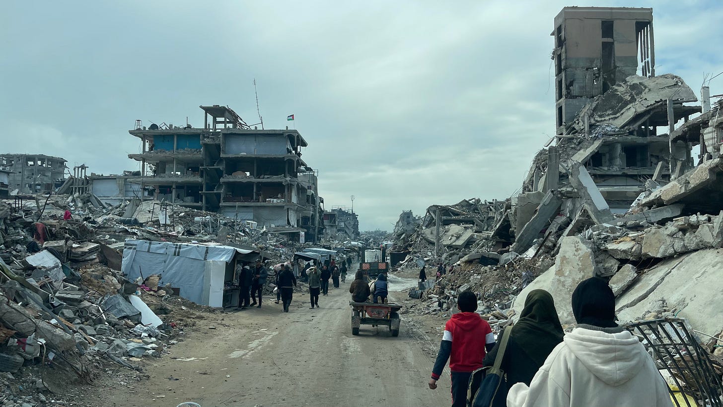 Palestinians in the ruins of Beit Lahia, destroyed by Israeli bombing of the Gaza Strip, February 22, 2025