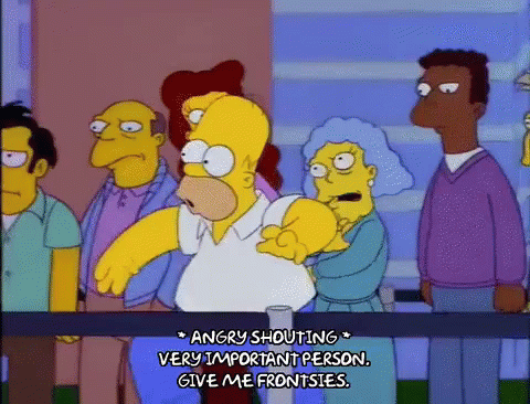 homer simpson is angry shouting at a very important person .