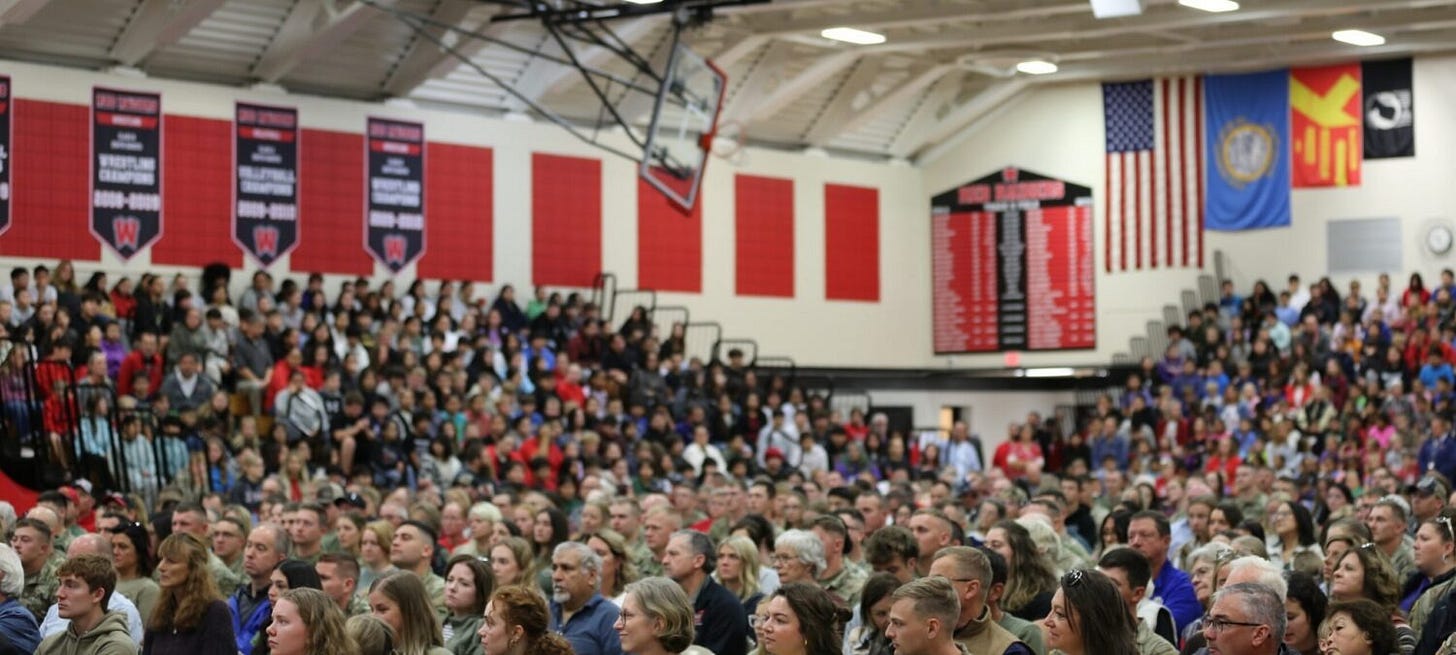 The school gymnasium in Wagner, South Dakota, is full of people on Oct. 22, 2026, for a ceremony honoring about 120 South Dakota National Guard soldiers deploying to the U.S.-Mexico border for a year. (Photo by Joshua Haiar/South Dakota Searchlight)