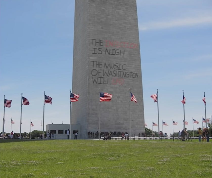 The Washington Monument is painted and vandalized by angry protestors.