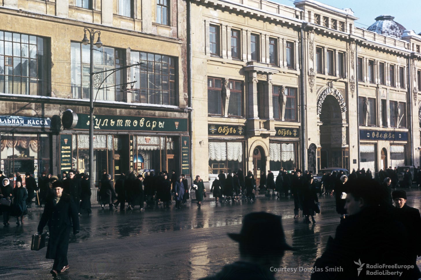 A commercial hub: Petrovka ulitsa and the grand entrance to Moscow’s Petrovsky Passazh department store, a glimpse into 1950s retail. A commercial hub: Petrovka ulitsa and the grand entrance to Moscow’s Petrovsky Passazh department store, a glimpse into 1950s retail.
