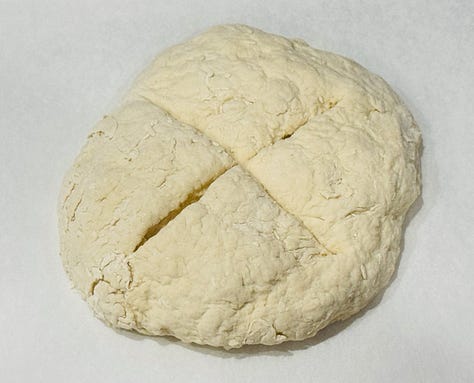 White soda bread dough being mixed with a Swedish dough whisk in a large bowl. Shaped soda bread round with a deep cross cut into the top before baking. Finished Irish white soda bread cooling on a wire rack, golden and crusty.