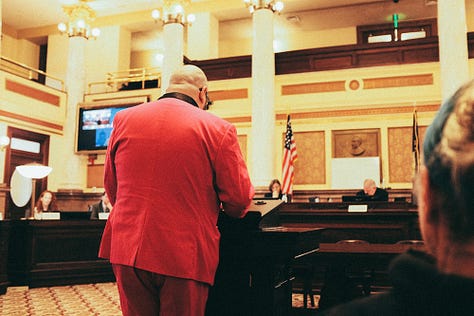 starbucks barista, mirror reflections, man protesting, by Tyler Knott Gregson