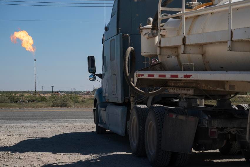 A semi-truck waits to turn onto Texas State Highway 158 after disposing of its load at a salt-water disposal site Tuesday, June 25, 2024, south of Midland. A semi-truck waits to turn onto Texas State Highway 158 after disposing of its load at a salt-water disposal site Tuesday, June 25, 2024, south of Midland.