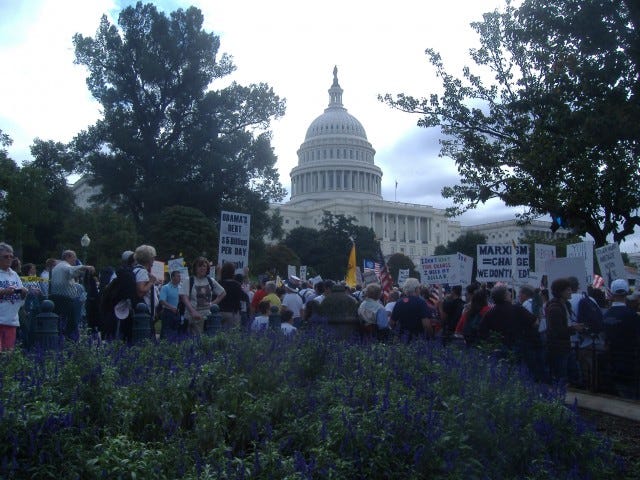 About 11:30 we arrived at the Capitol for the main protest. I thought this was a pretty shot with the flowers and the Capitol dome in the background. About 11:30 we arrived at the Capitol for the main protest. I thought this was a pretty shot with the flowers and the Capitol dome in the background.