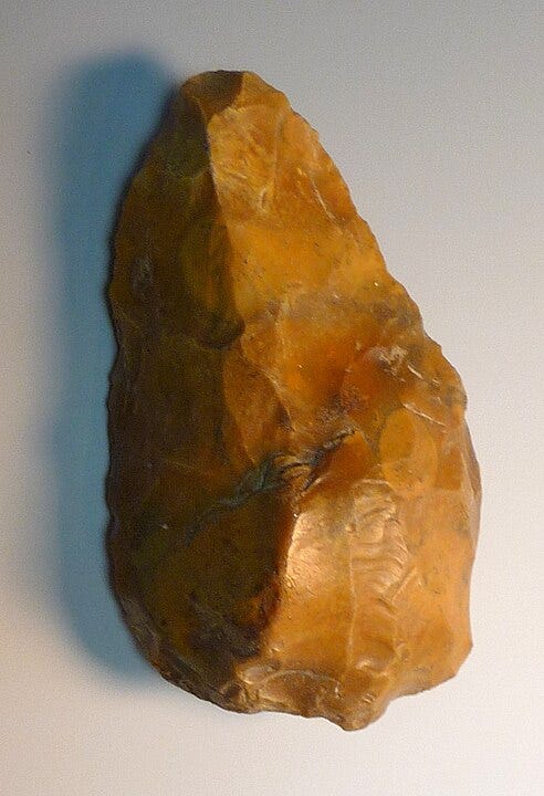 an orange stone with a sharp edge an orange stone with a sharp edge