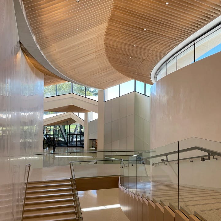 An elegant, open stairwell and upper windows.