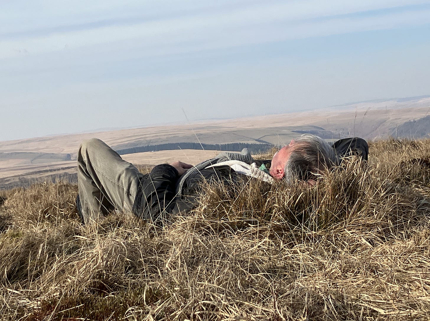 A person lying in a field

AI-generated content may be incorrect.