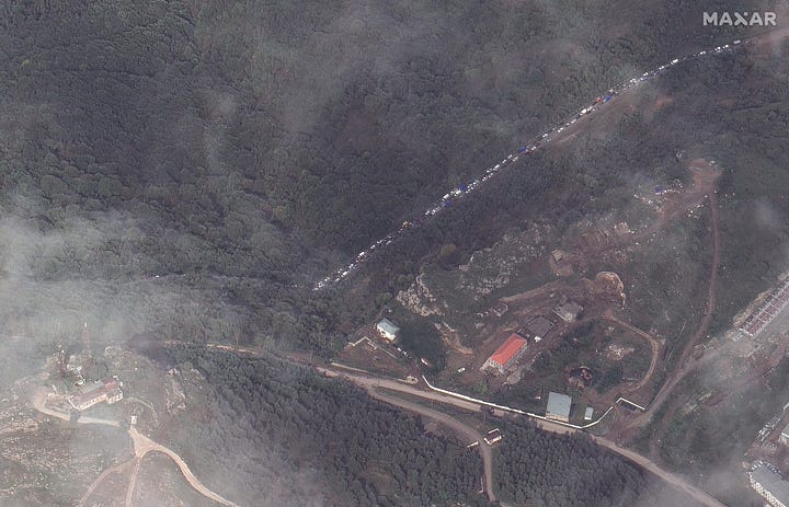 Satellite pictures show long queues of cars waiting to cross into Armenia
