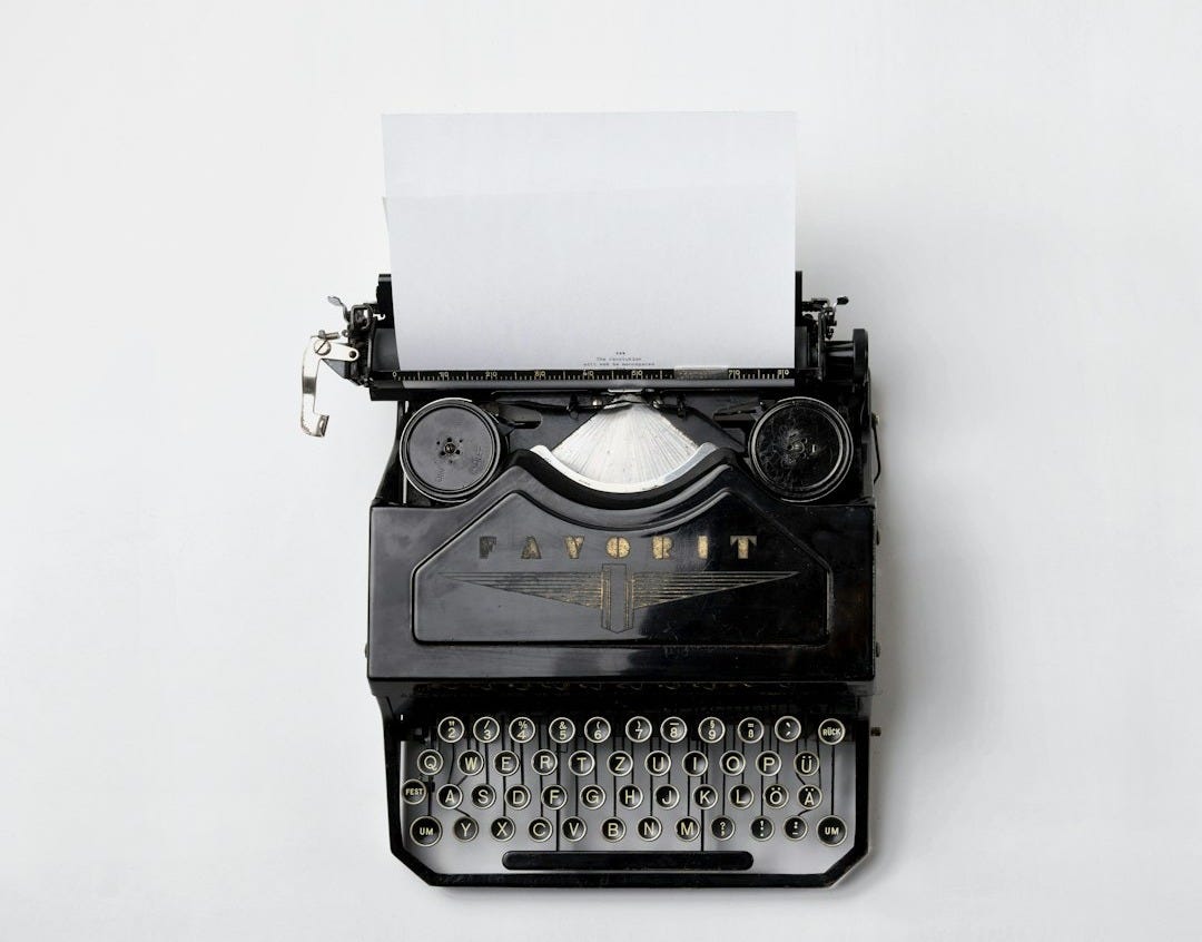 black Fayorit typewriter with printer paper black Fayorit typewriter with printer paper