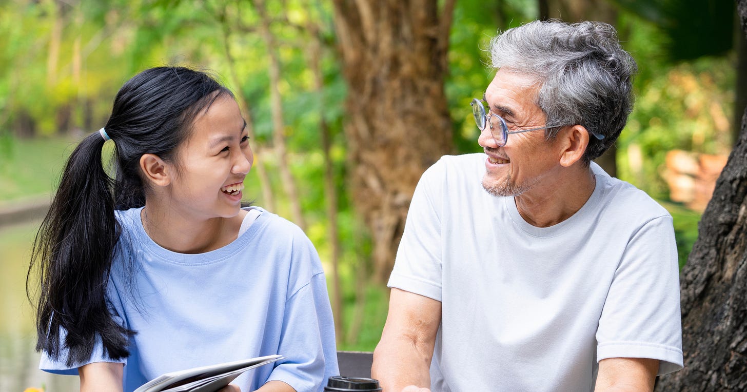 A young person and an elder talking outdoors A young person and an elder talking outdoors
