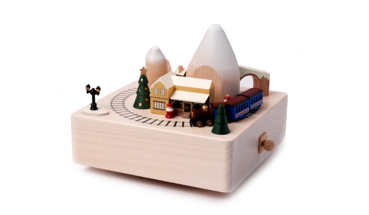 Wooden Winter Train Music Box against a white background