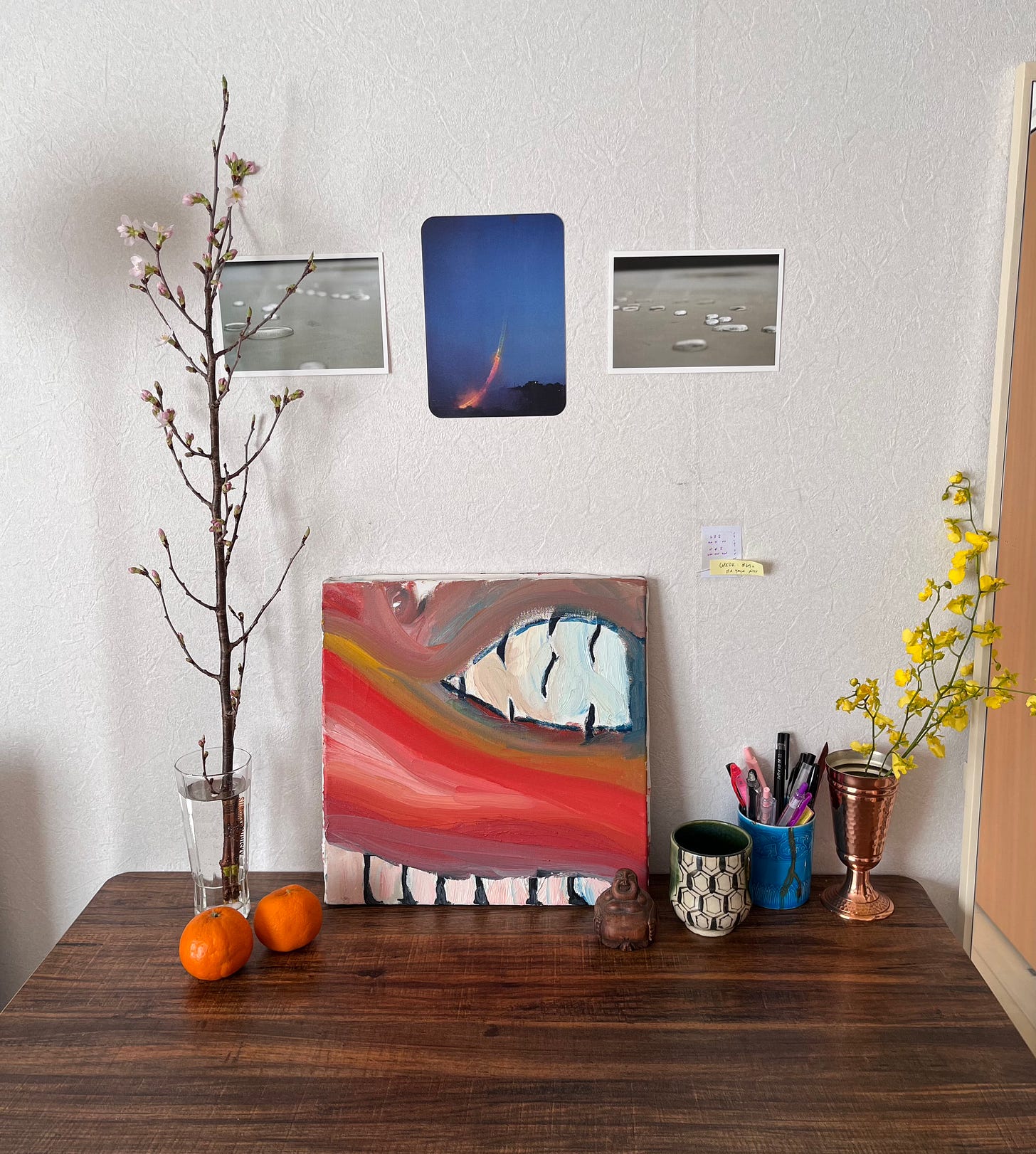 three postcards of fire and water over a painting of a dragon and flowers on either side