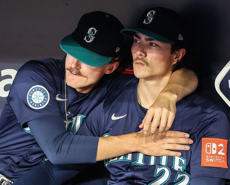 Bryce Miller puts his arm around teammate Bryan Woo after the Mariners lost Game 7 of the ALCS to Toronto.  The Seattle Mariners played the Toronto Blue Jays in the deciding Game 7 of the ALCS Monday, October. 20, 2025 at Rogers Centre, in Toronto, Canada. (Dean Rutz / The Seattle Times)
