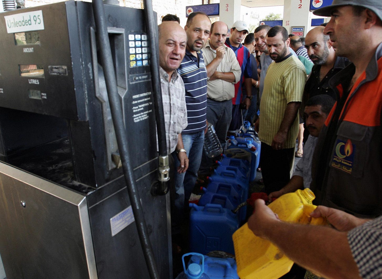 Lebanese drivers wait in line to fill up