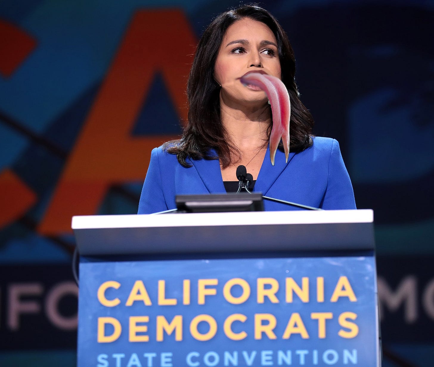 Tulsi Gabbard with lizard tongue speaking at California state Democratic Convention Tulsi Gabbard with lizard tongue speaking at California state Democratic Convention