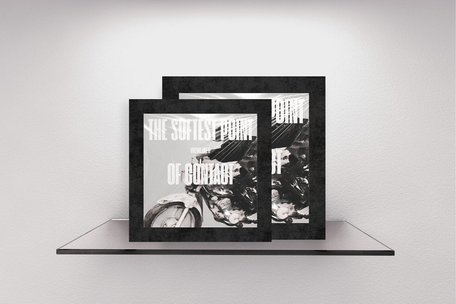 Two staggered magazine covers with thick textured black borders on a gallery shelf. The front cover features a high-contrast, black-and-white graphic of a figure on a vintage motorcycle, speeding at a low angle. Stacked, tall typography reading "THE SOFTEST POINT OF CONTACT" covers the image. Part of the Viewlines series at The Subtext Review.
