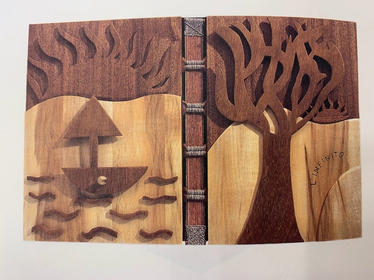 binding made of wood depicting a large tree on one board and a boat on waves underneath a half sun on the other binding made of wood depicting a large tree on one board and a boat on waves underneath a half sun on the other