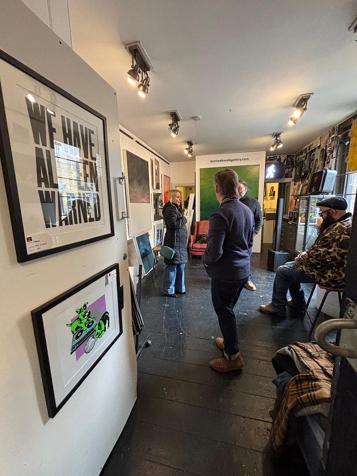 From a quiet street in Deal to the narrow hallway and intimate rooms beyond, the Walk Don't Walk Gallery invites visitors to step inside, be nosey, and discover an art space where humour, conversation and curiosity shape the experience as much as the works on the walls. — © Kent Chronicles