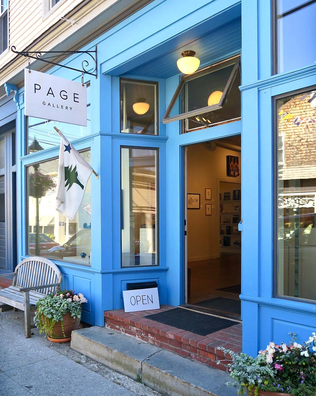 A blue store front with a sign

Description automatically generated