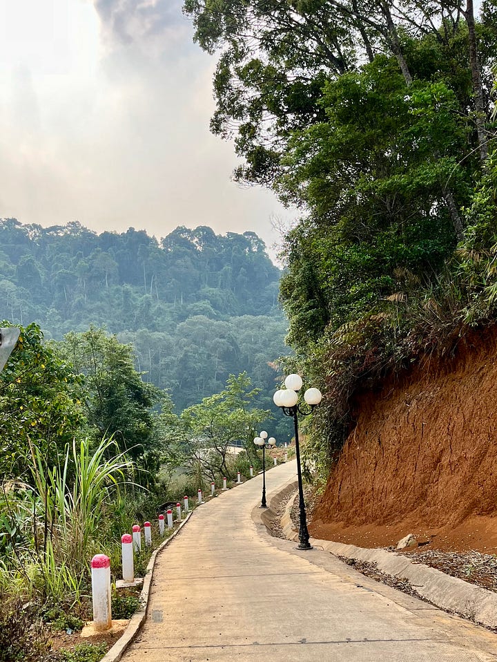A house under construction and a scenic road
