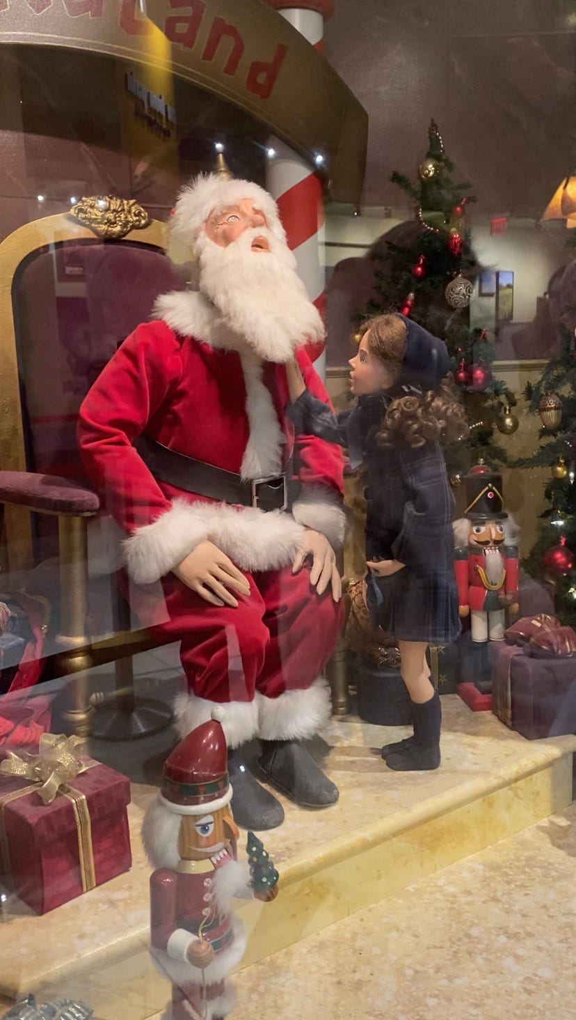 An animatronic reenactment of Susan Walker testing Santa's beard in Miracle on 34th Street. An animatronic reenactment of Susan Walker testing Santa's beard in Miracle on 34th Street.