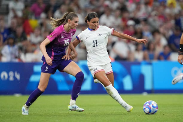 Sophia Smith of the United States plays the ball under pressure from Jule Brand of Germany during the second half of the Women's group B match during... Sophia Smith of the United States plays the ball under pressure from Jule Brand of Germany during the second half of the Women's group B match during...