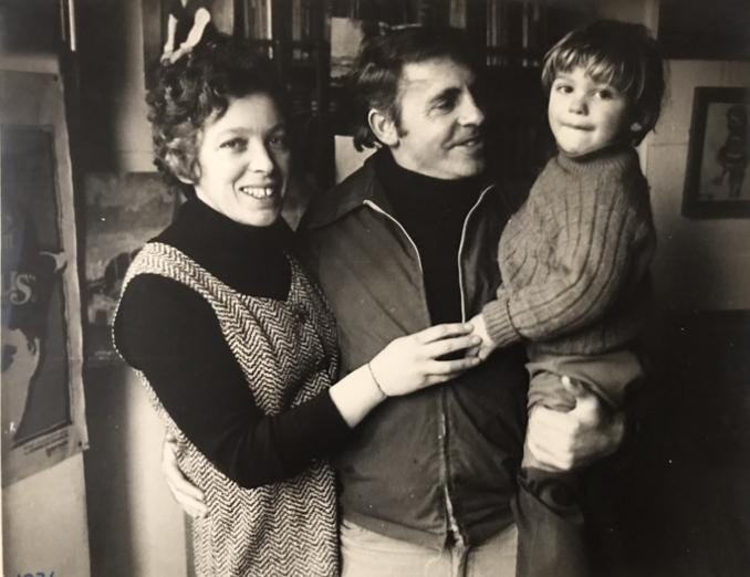 A person and person holding a child

Description automatically generated