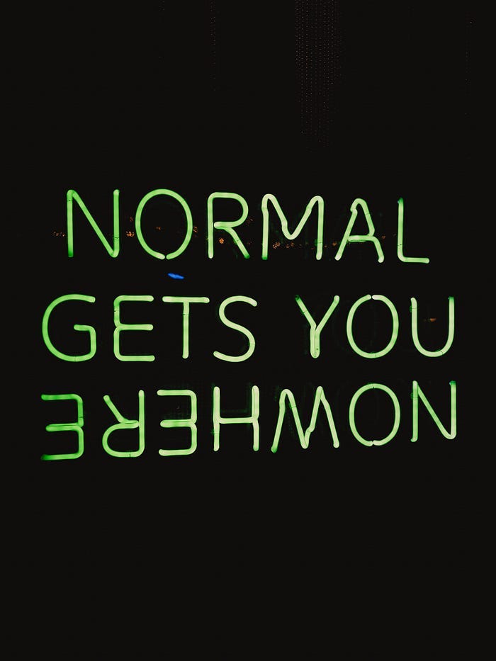 A neon sign. It reads: Normal gets you nowhere. The word ‘nowhere’ is spelled backwards. A neon sign. It reads: Normal gets you nowhere. The word ‘nowhere’ is spelled backwards.