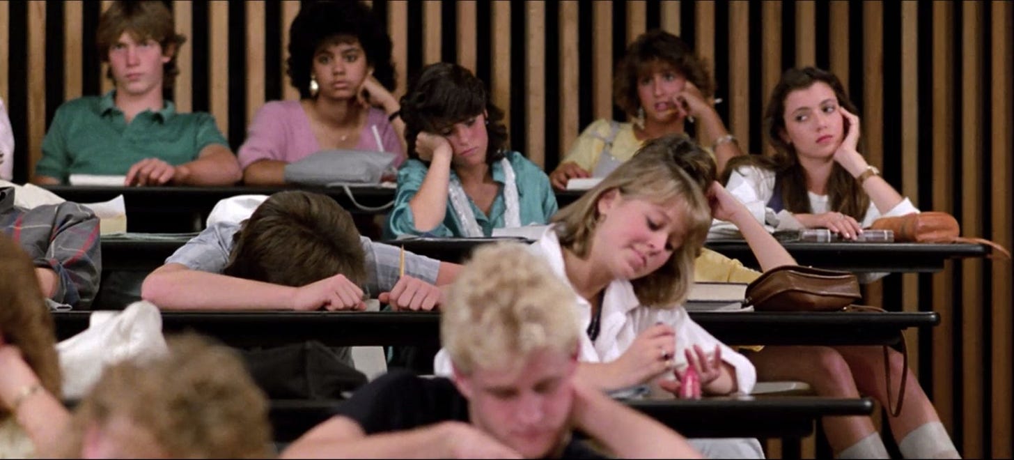 University students in a lecture hall looking disengaged, symbolizing outdated education models built for linear career paths. University students in a lecture hall looking disengaged, symbolizing outdated education models built for linear career paths.