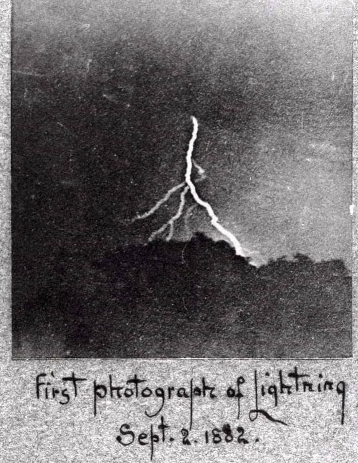 This may contain: a black and white photo with the words first photograph of lightning