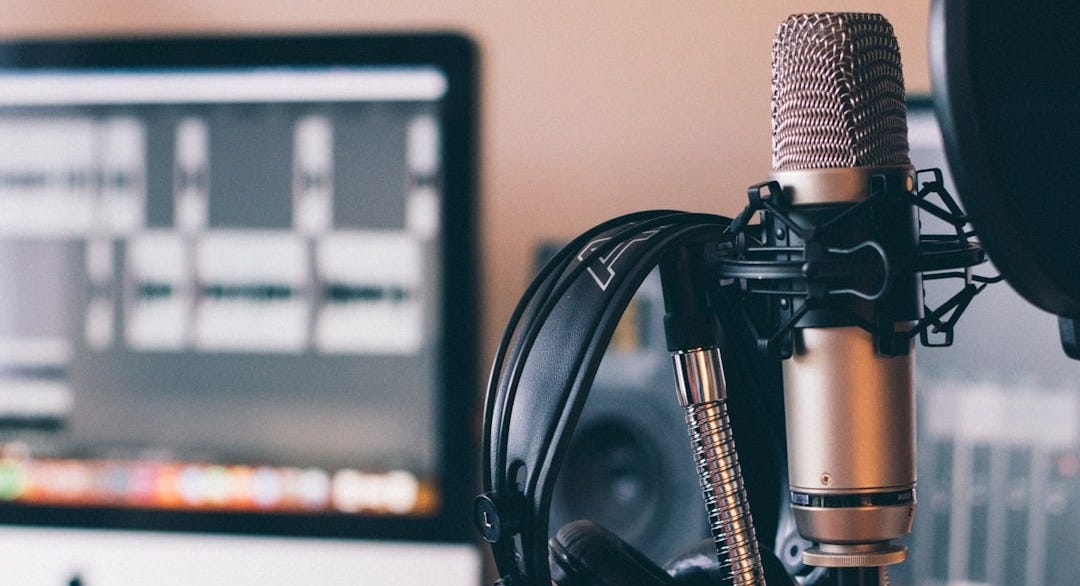 black and silver headphones on black and silver microphone