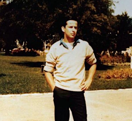 A person standing outside with his hands in his pockets

Description automatically generated