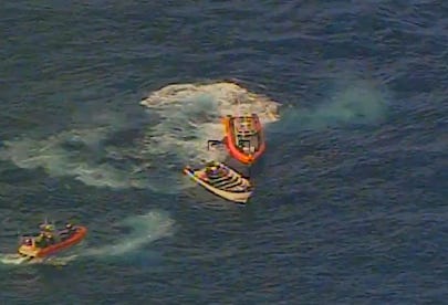 Boat crews launched from the Coast Guard Cutter Munro boarded the smuggling vessel after its engines were disabled, arrested its crew, and seized its large load of cocaine.