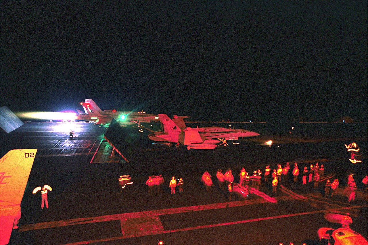 Photo: U.S. Navy Photo by Photographer's Mate 3rd Class Jesi R. Werling. / Wikimedia Commons (Public domain) At sea abord USS Harry S. Truman (CVN 75), Arabian Gulf (Feb. 16, 2001) -- An F/A-18 "Hornet" from the "Bulls" of Strike Fighter Squadron Three Seven (VFA-37) launches from the flight deck. Truman is on station in the Arabian Gulf in support of Opera