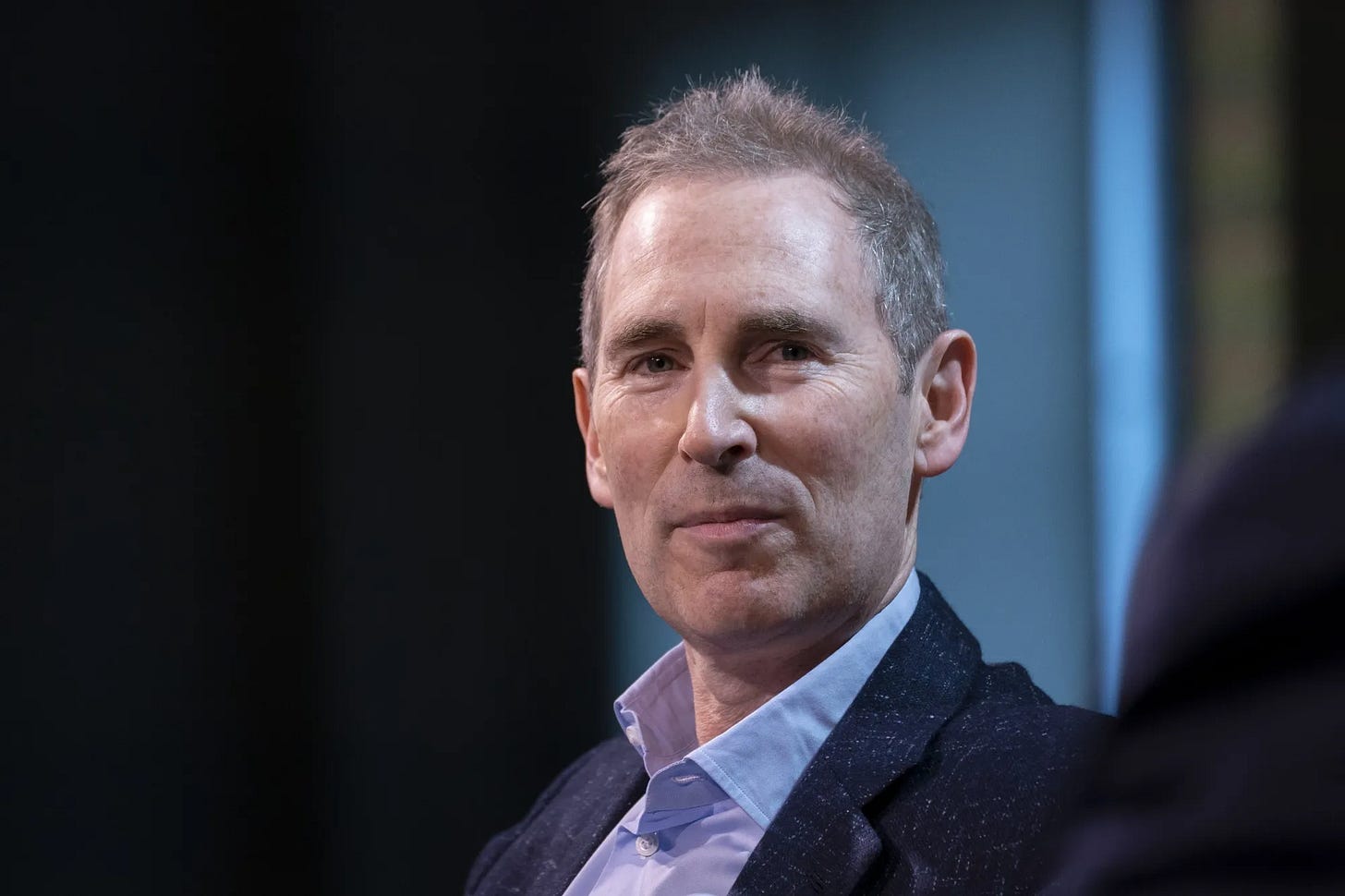 Andy Jassy speaking at an event, Amazon CEO known for “disagree and commit” email. Andy Jassy speaking at an event, Amazon CEO known for “disagree and commit” email.