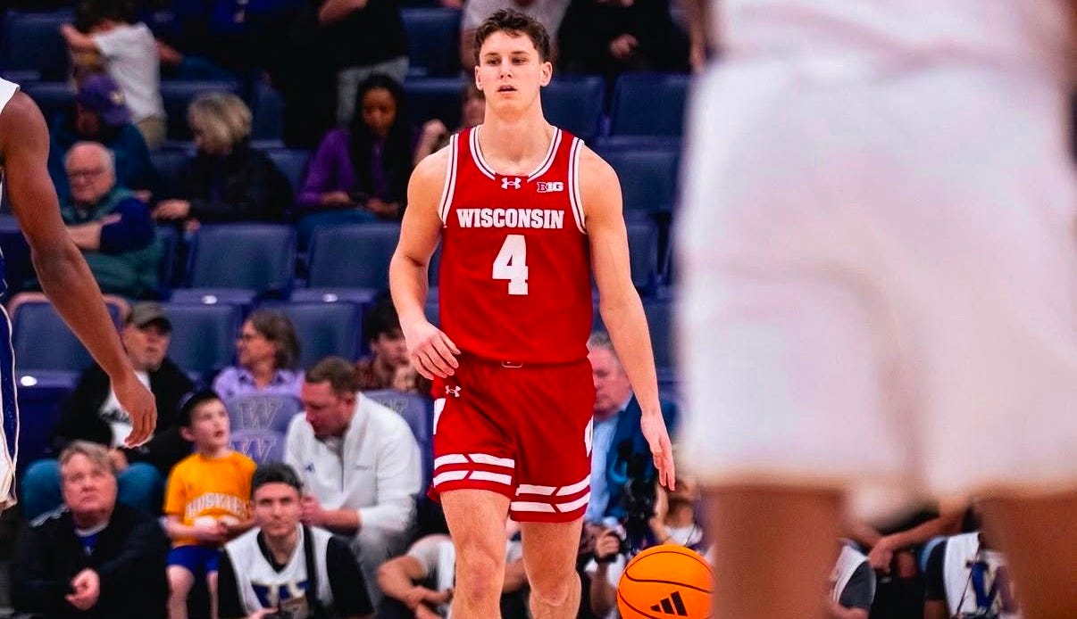 Wisconsin guard Zach Kinziger dribbles the ball up the court during a game. Wisconsin guard Zach Kinziger dribbles the ball up the court during a game.