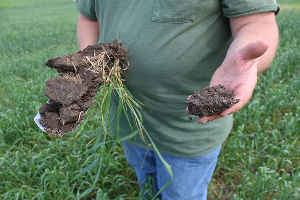 Gabe Brown with soil from neighbor's field