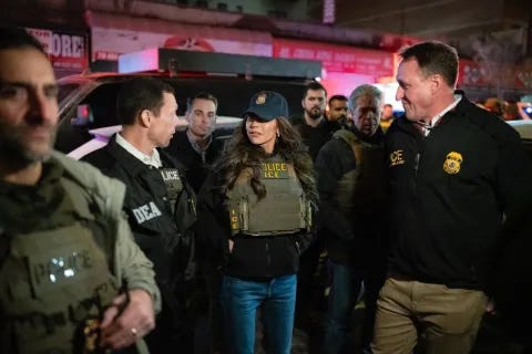 Caption: <p>Secretary Noem with law enforcement outside one of the targets of the removal operation.</p>