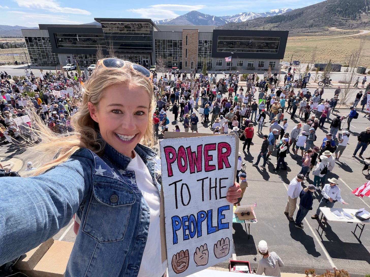 May be an image of one or more people, people standing, banner and text that says 'POWER TOTHE TO THE PEOPLE'